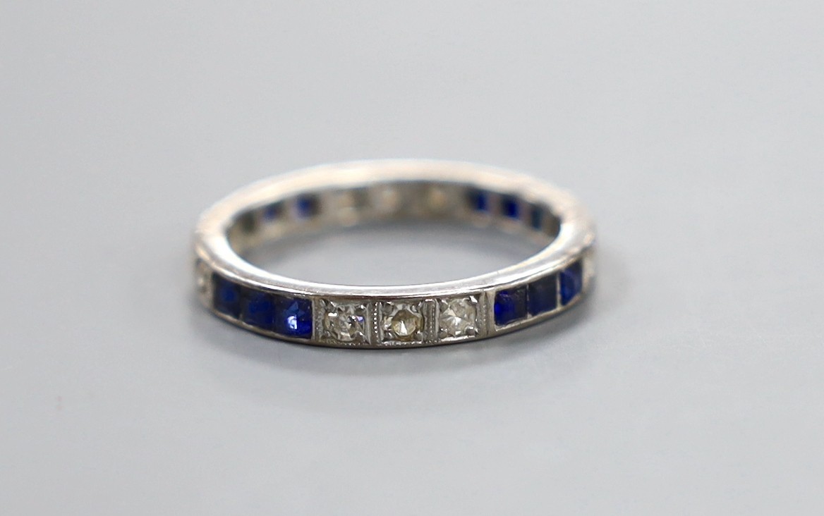 A white metal, square cut sapphire and round cut diamond set full eternity ring, size Q, gross weight 3.8 grams.